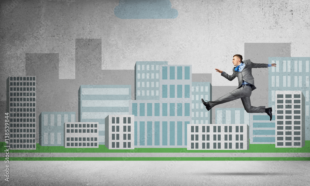 Businessman jumping high