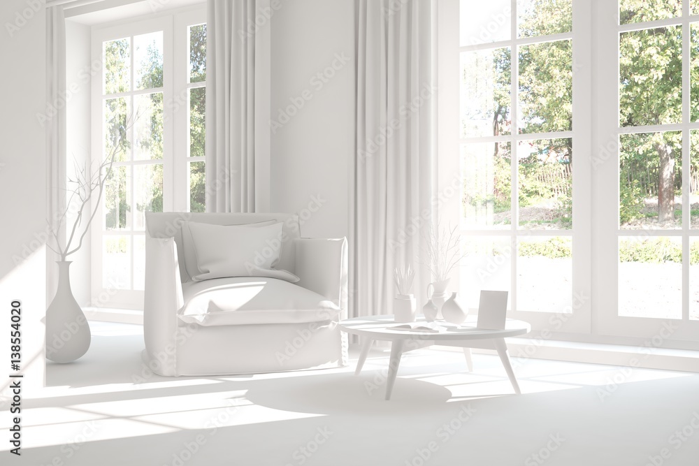 White room with armchair and green landscape in window. Scandinavian interior design