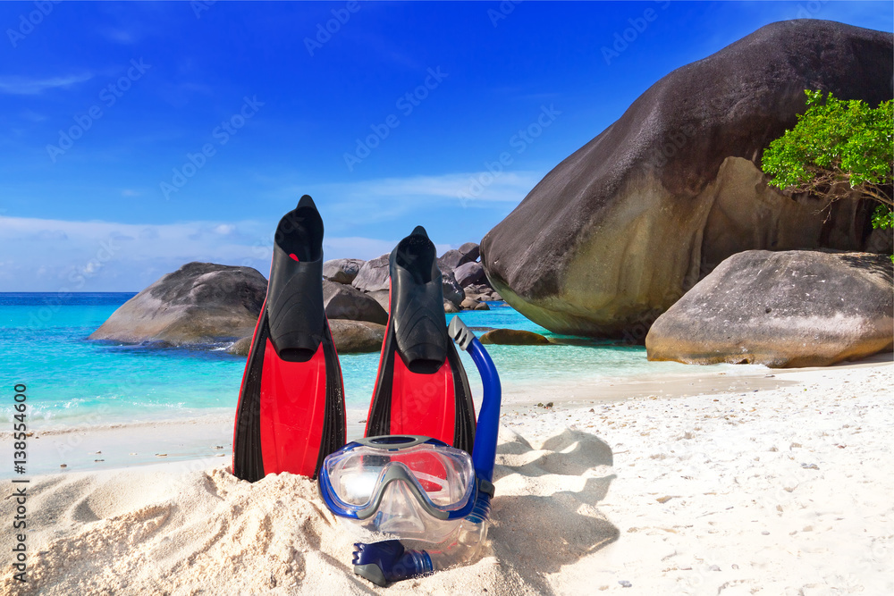 Snorkeling mask and fins on the tropical beach