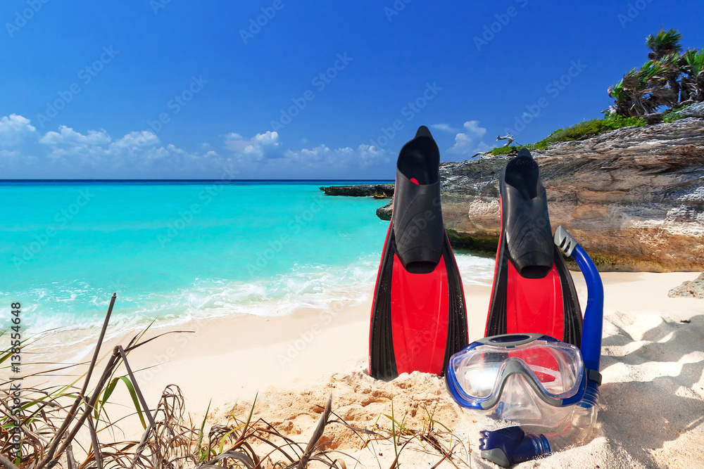 Snorkeling mask and fins on the tropical beach