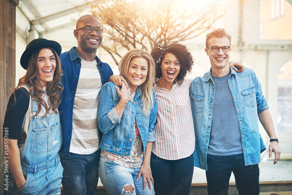 Five friends smiling to camera