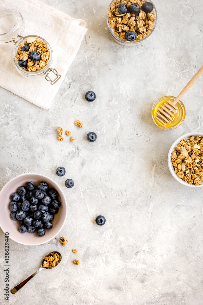 Oat flakes with honey and berries on table background top view