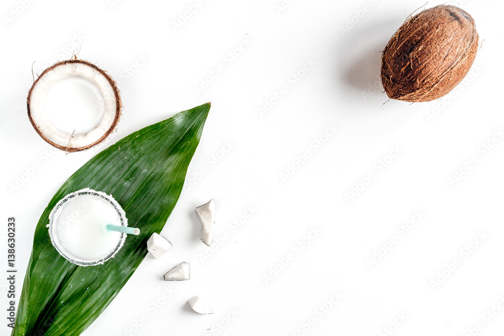 cocktail with coconut on white background top view