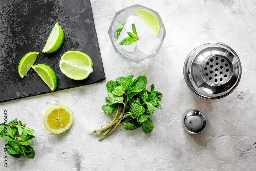 making mojito on stone background top view