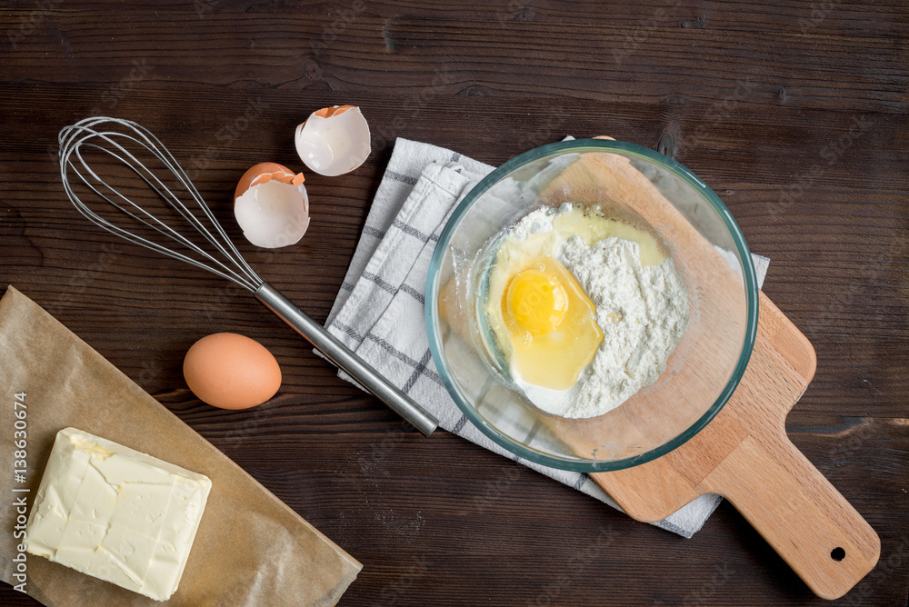 cooking pancake on wooden background top view ingredients for making