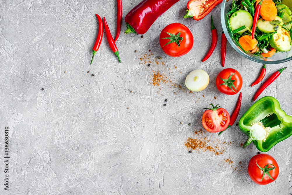 cooking vegetables on the stone background top view