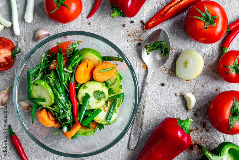 cooking vegetables on the stone background top view