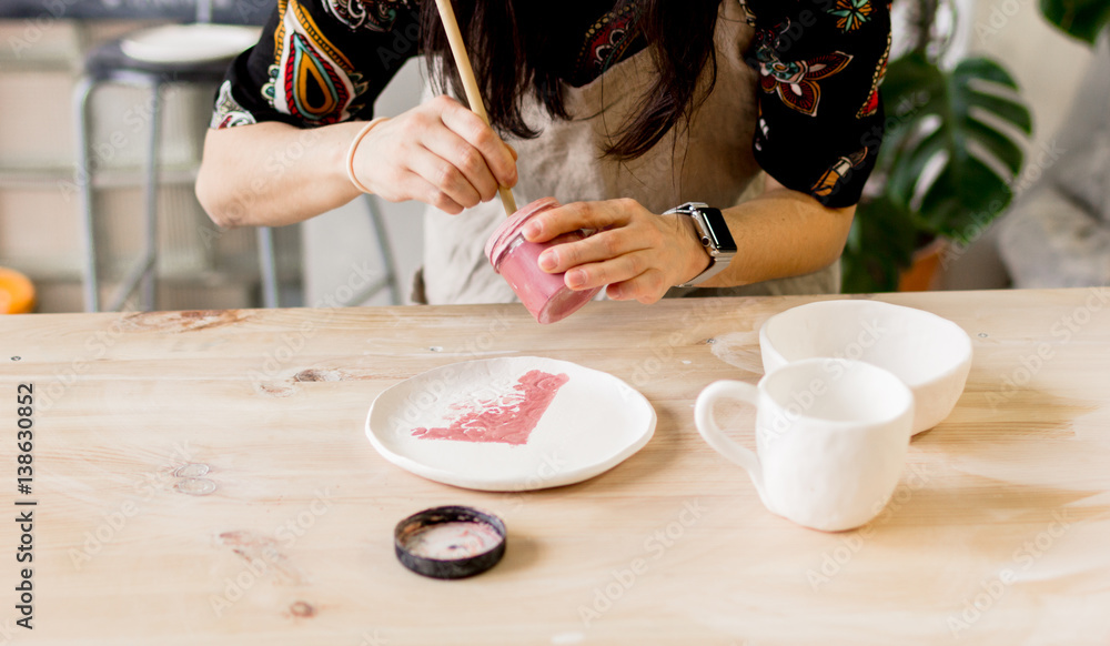 workshop production of ceramic tableware product painting