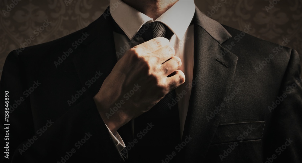 Businessman adjusting his look