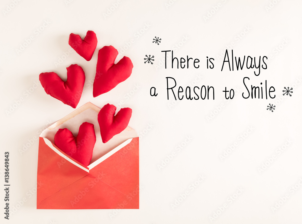 There Is Always A Reason To Smile message with red heart cushions