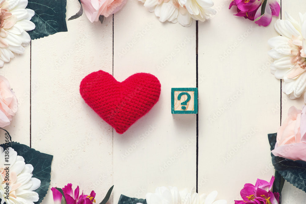 Red heart with I LOVE YOU in cube on wood table