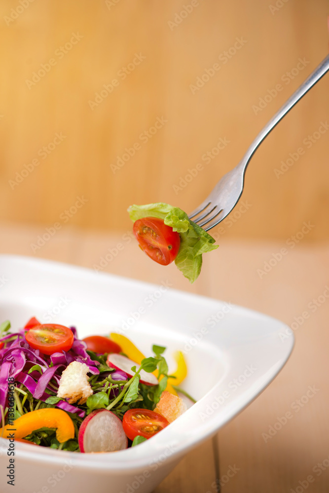 Homemade fresh green vegetable salad on table. Close-up.