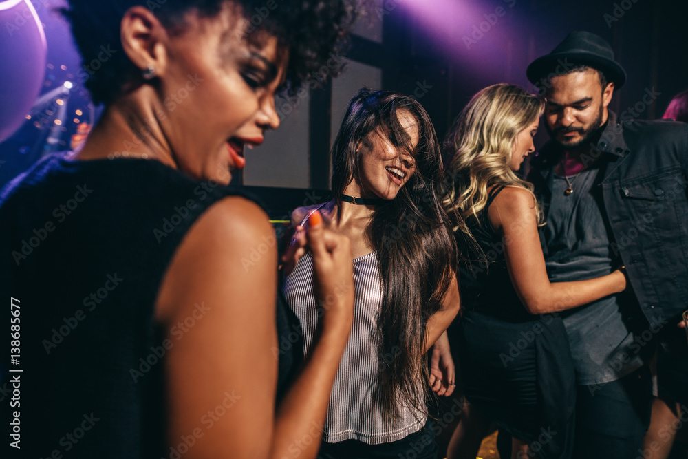 Friends having fun together at the nightclub