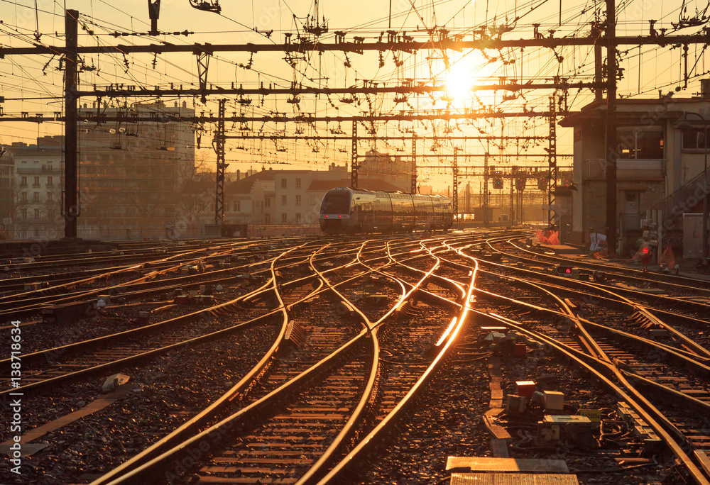 A train on the railroad tracks at Perrache station in Lyon (Gare de Lyon-Perrache), France, during s