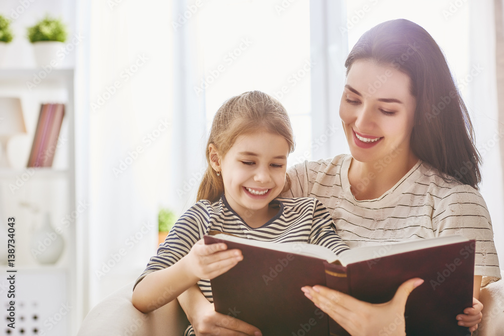 mother and daughter reading a book