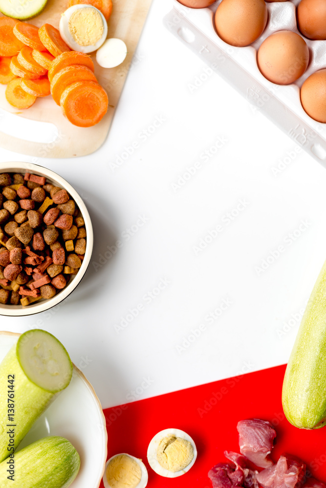 healthy dry dogfood with ingredients on table top view mock up