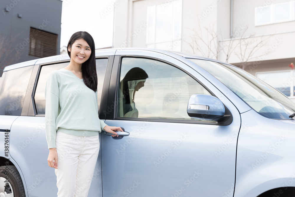 attractive asian woman with car