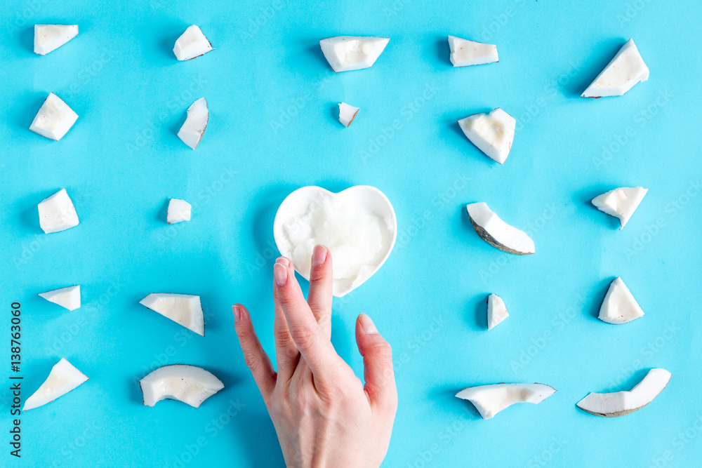 concept organic cosmetics with coconut on blue background top view