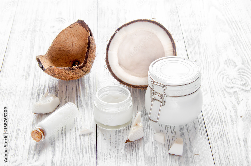 organic cosmetics with coconut on wooden background close up