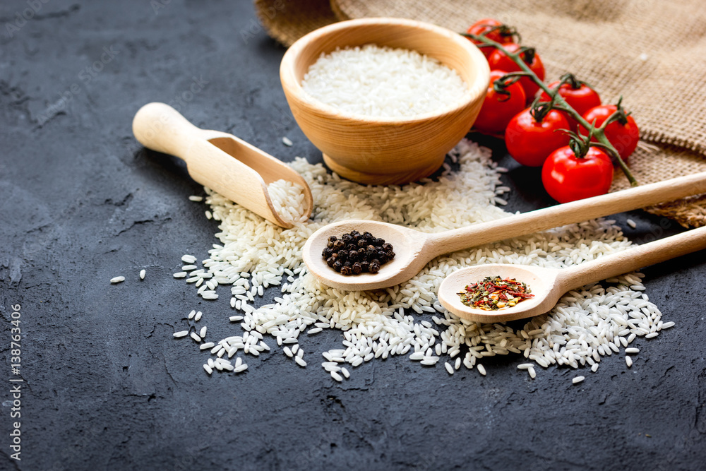 ingredients for paella on dark background