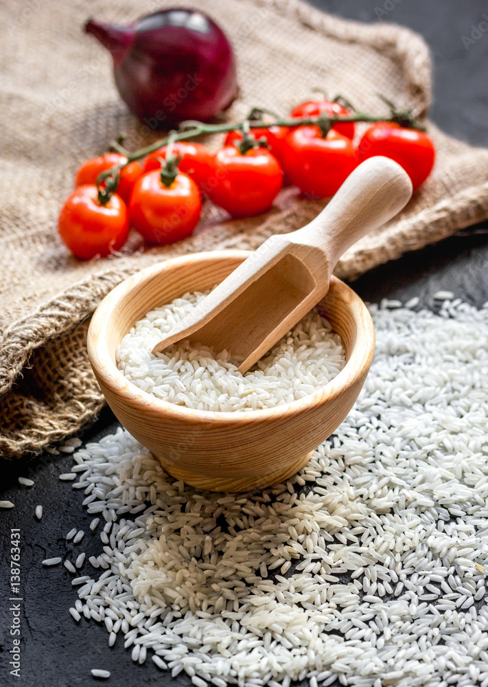 ingredients for paella on dark background