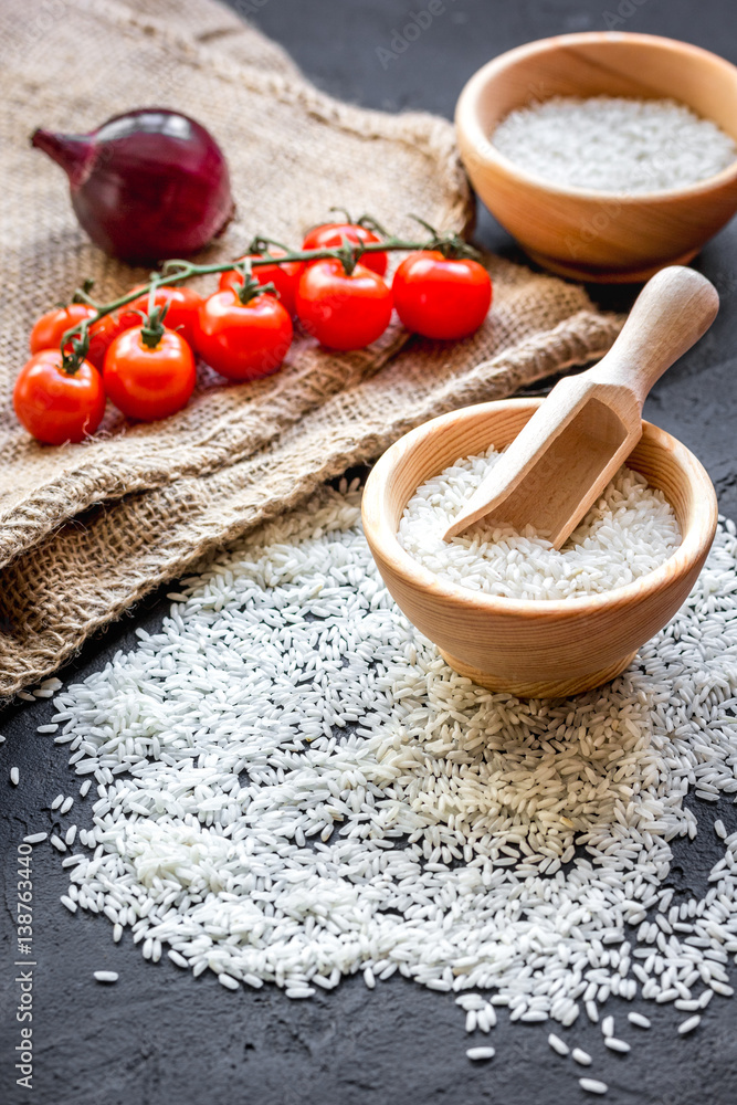 ingredients for paella on dark background