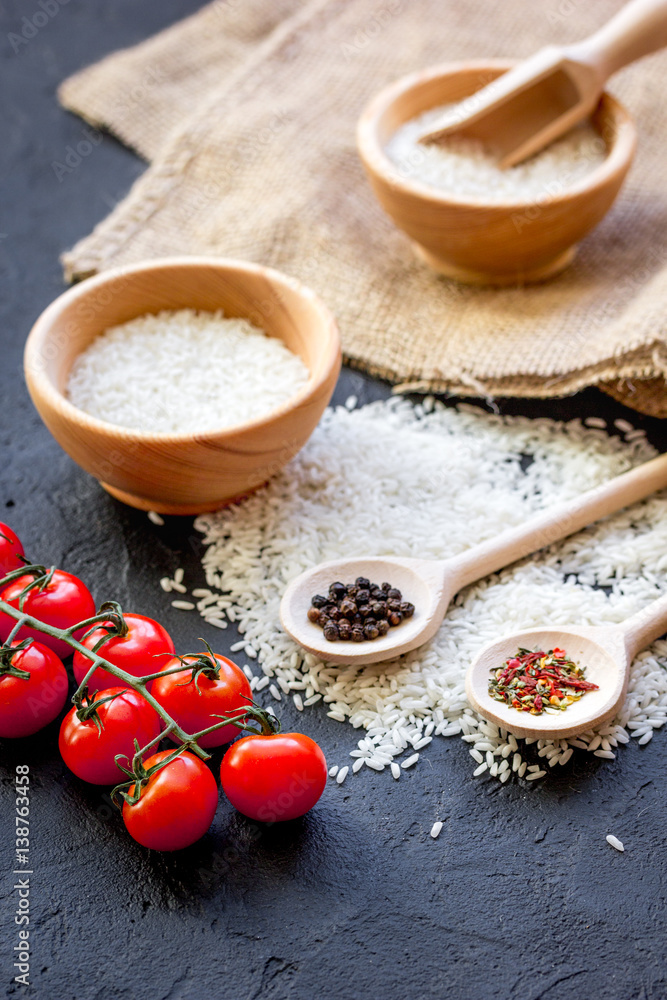 ingredients for paella on dark background