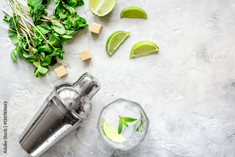 making mojito on stone background top view