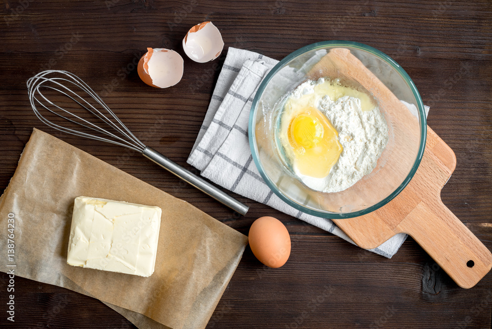 cooking pancake on wooden background top view ingredients for making