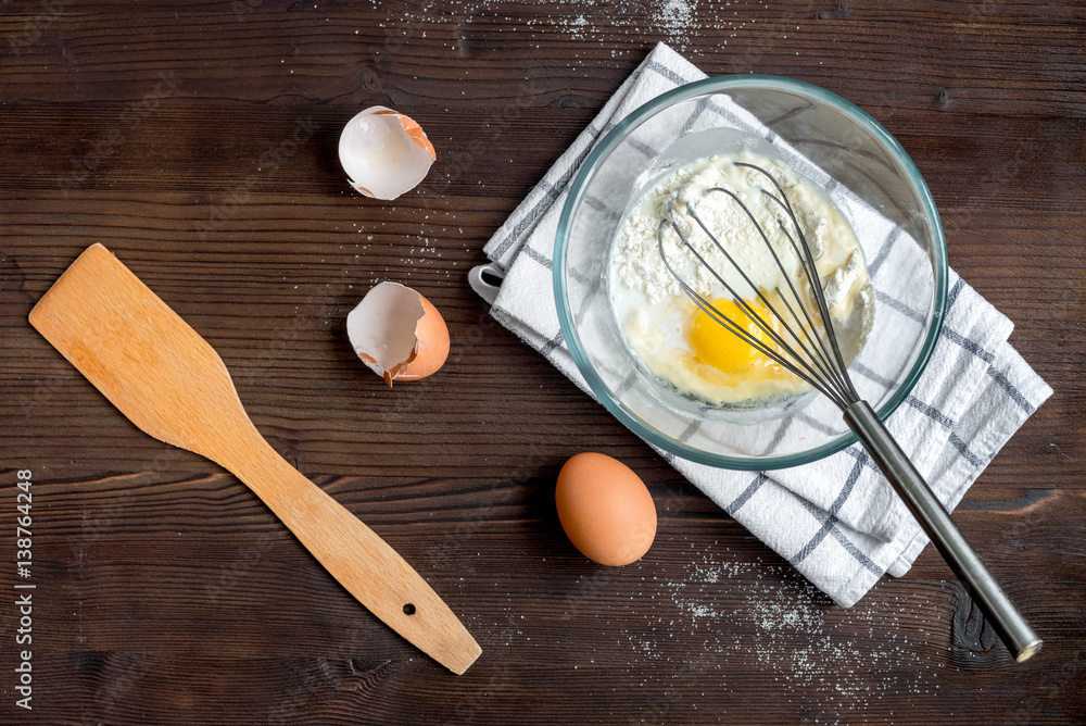 cooking pancake on wooden background top view ingredients for making