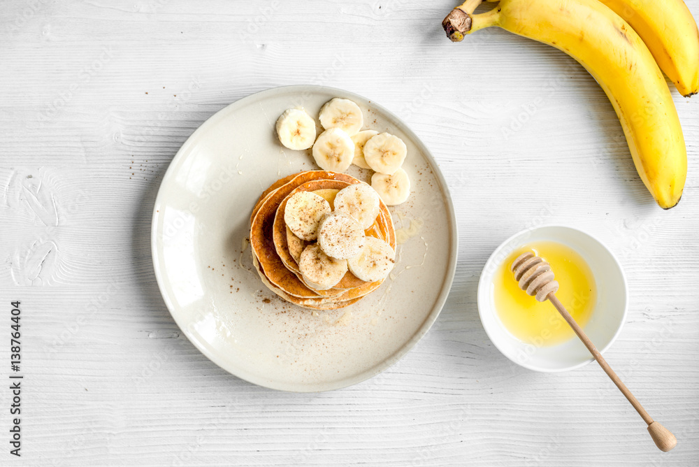 cooked pancake on plate top view at wooden background