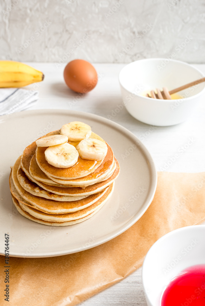 cooked pancake on plate at wooden background