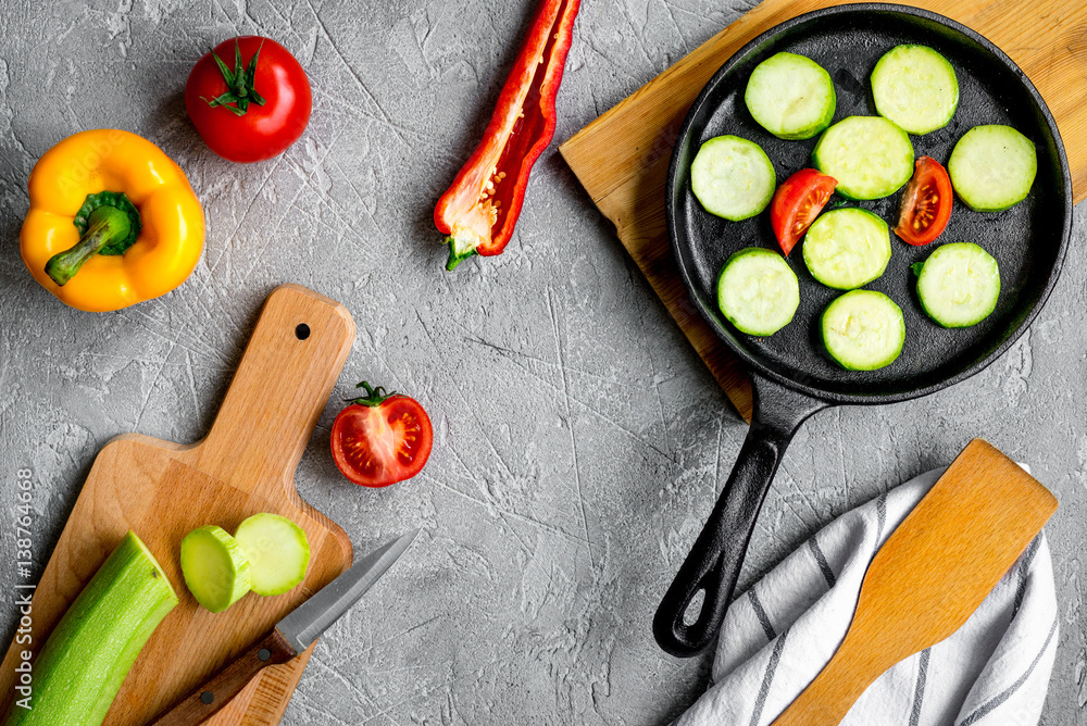 cooking vegetables on the stone background top view