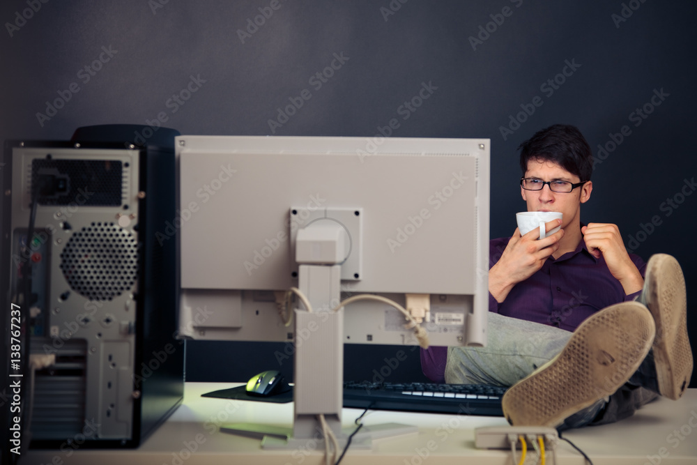 Relaxed Admin At His Desk