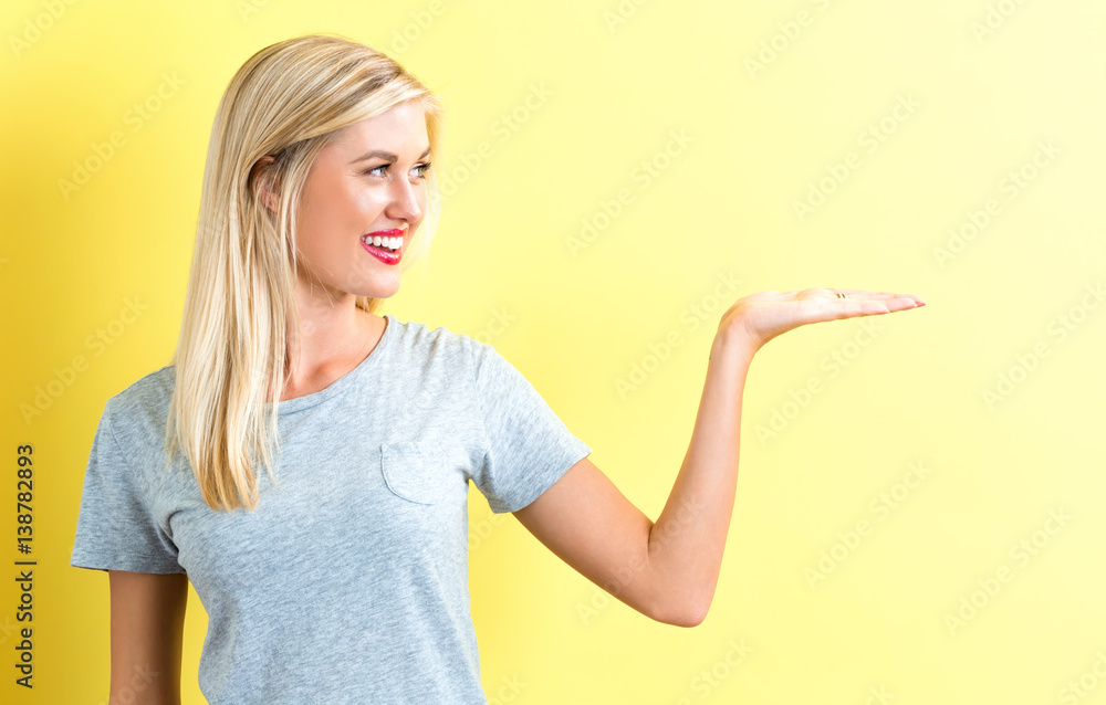 Young woman with a displaying hand gesture