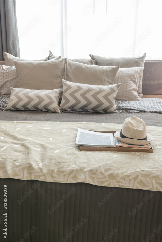 set of pillows on bed in cozy bedroom