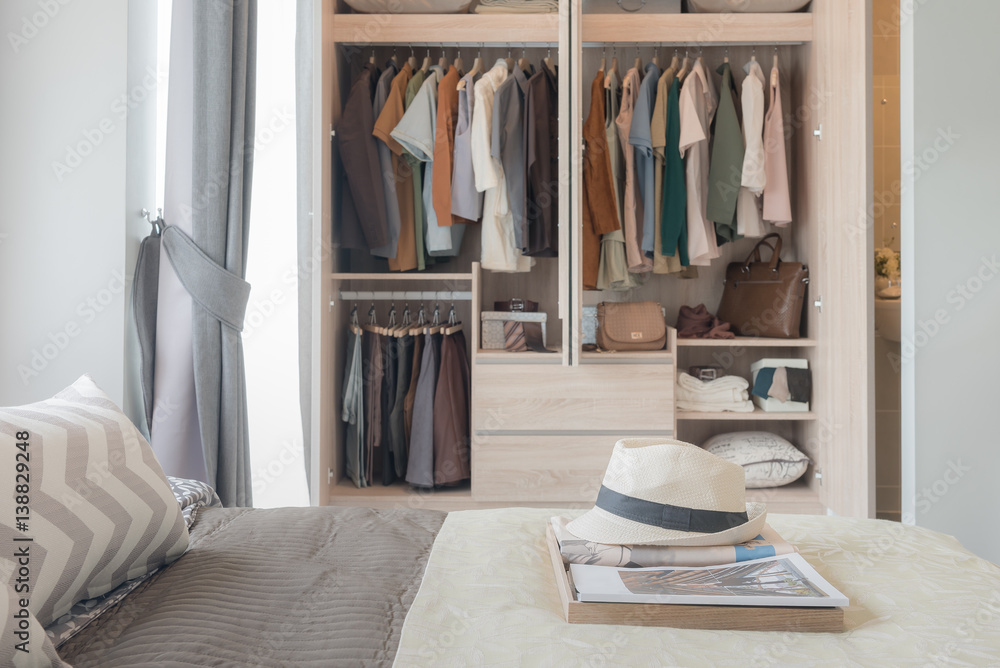 tray of hat and newspaper on bed in modern bedroom