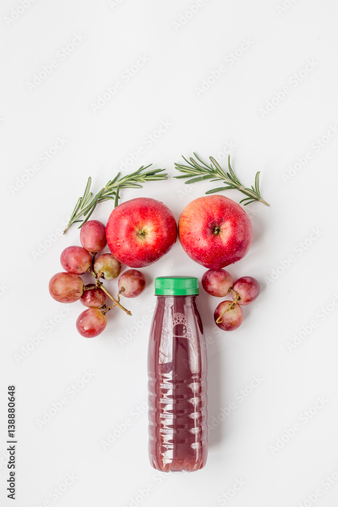 apple and grape juice in bottle on white background top view mockup