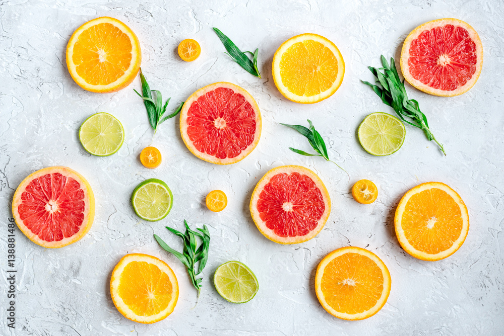 sliced citrus pattern on stone table background top view