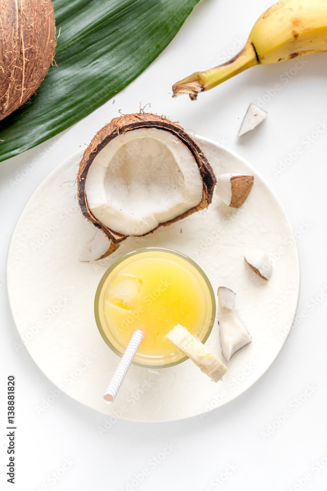 cocktail with coconut on white background top view