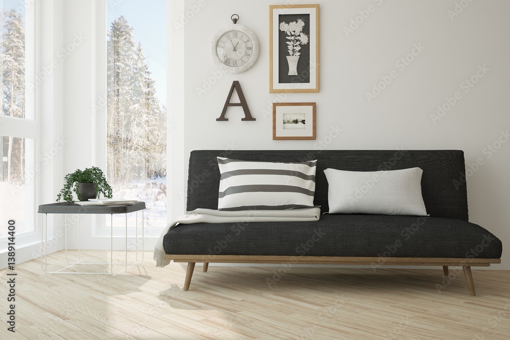 White room with sofa and winter landscape in window. Scandinavian interior design