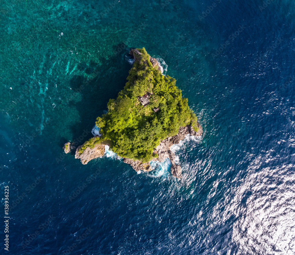 Aerial shot of the tropical islet in the sea