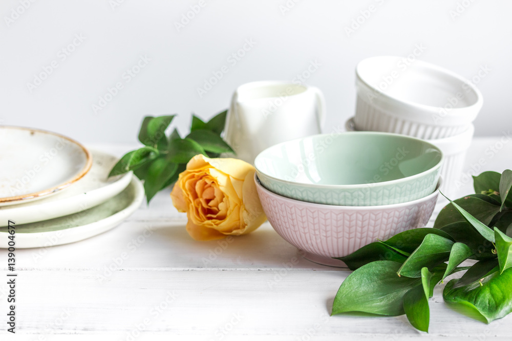 ceramic tableware with flowers on white background