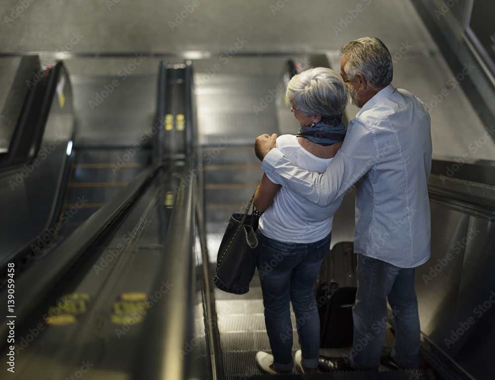 Senior couple tourists traveling city