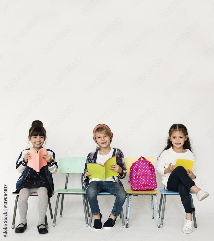 Happiness group of cute and adorable students reading book