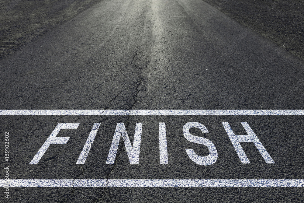 Sunny finish line racing background on asphalt floor.