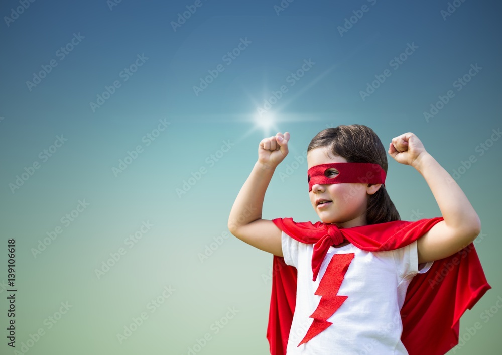 Girl in superhero costume showing fists