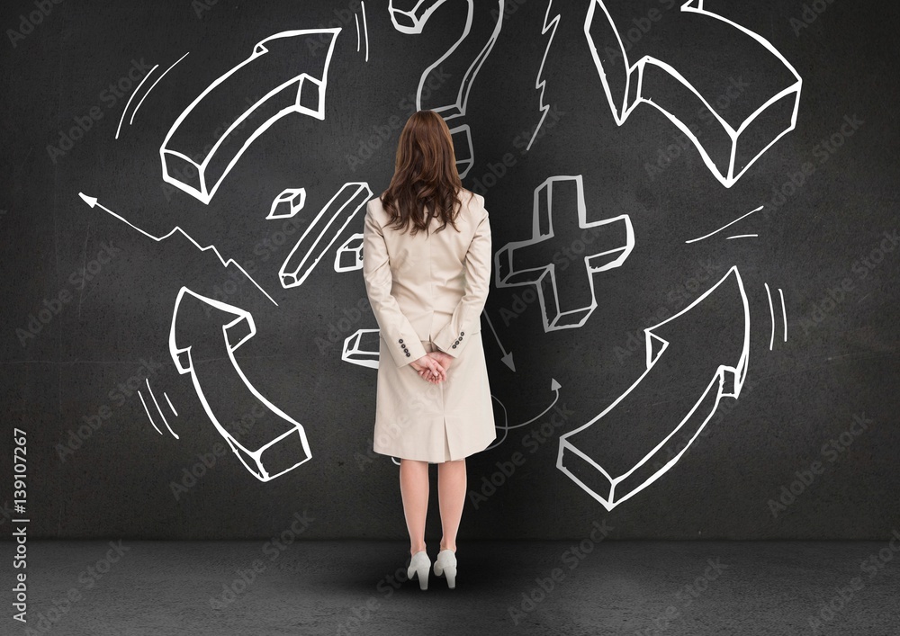 Businesswoman looking at business plan concept on blackboard