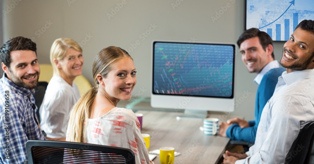 Business executives sitting in conference room during meeting