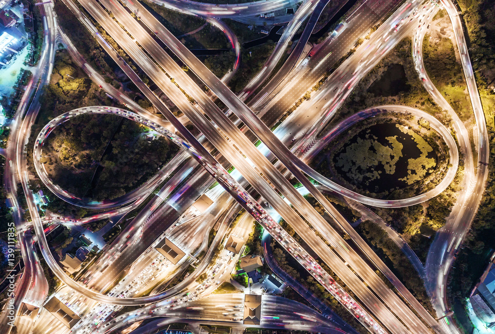 The light on the road  roundabout at night and the city in Bangkok, Thailand. Aerial view, Top view.